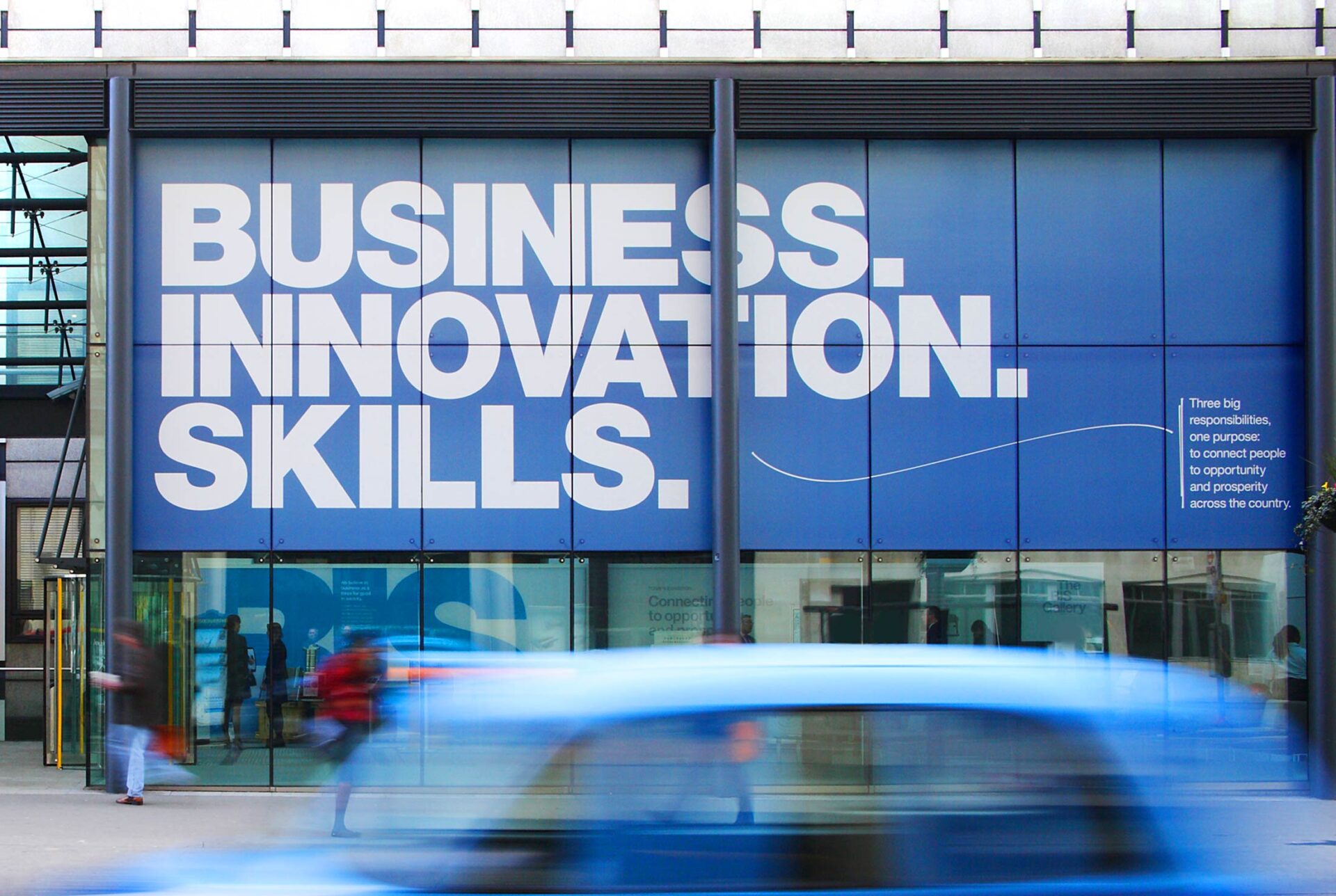 Photo image of the Dept for BIS front window with branded decal, blue with white text